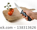 Preparing to Slice Fresh Tomatoes on a Cutting Board 138313626