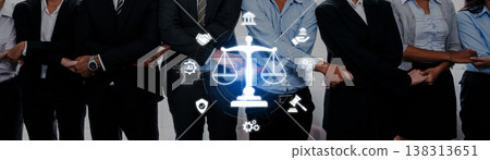 Team of Professionals Collaborating on Legal Concepts with Symbols Representing Justice and Law in a Modern Office Environment Trope Team of Professionals Collaborating on Legal Concepts with Symbols Representing Justice and Law in a Modern Office Environment Trope 138313651
