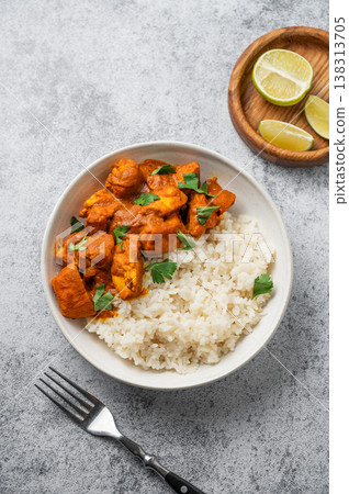 Chicken tikka masala curry with rice on concrete background 138313705