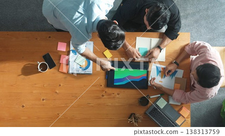 Top view of manager talking about financial graph to investors. Convocation. Top view of manager talking about financial graph to investors. Convocation. 138313759