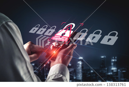 Person Holding Smartphone in Dark Cityscape with Overlay of Data Breach Illustration Representing Cybersecurity Threats and Digital Vulnerabilities Ledger 138313761