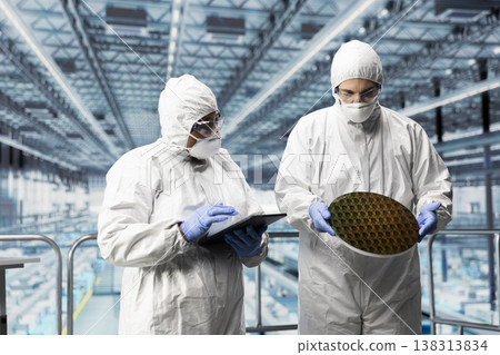Planning silicon wafer upgrades, bunny suit and hardware designers in microchip smart factory. Managing semiconductor substrates production, safety gear and employees in industry 4.0 plant Planning silicon wafer upgrades, bunny suit and hardware designers in microchip smart factory. Managing semiconductor substrates production, safety gear and employees in industry 4.0 plant 138313834