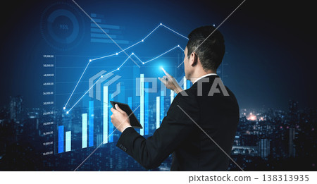 Business professional analyzing futuristic data visualizations with graphs and charts against a city skyline at night, reflecting growth and technology Scalp Business professional analyzing futuristic data visualizations with graphs and charts against a city skyline at night, reflecting growth and technology Scalp 138313935