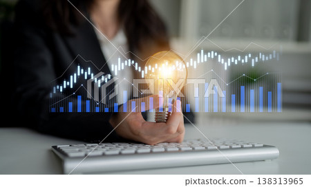 Business insight with light bulb, graph chart, keyboard, and modern workspace concept for innovation in finance and strategic planning Scalp Business insight with light bulb, graph chart, keyboard, and modern workspace concept for innovation in finance and strategic planning Scalp 138313965