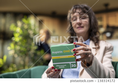 Senior person checking supplement and medicine boxes at home. Elderly care and in-home healthcare focus on prescribed dosage, disease management and recovery to support vitality. Senior person checking supplement and medicine boxes at home. Elderly care and in-home healthcare focus on prescribed dosage, disease management and recovery to support vitality. 138314172