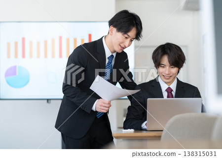A young businessman working in the office 138315031