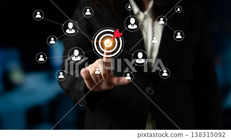 Business professional targeting network connections with digital interface and user icons in dark environment Ledger Business professional targeting network connections with digital interface and user icons in dark environment Ledger 138315092
