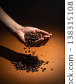 Coffee beans, hand, falling, dark background, vertical composition. 138315108
