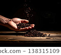 Coffee beans, hand, falling, dark background, horizontal composition. 138315109
