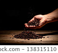 Coffee beans, hand, falling, dark background, carefully selected. 138315110