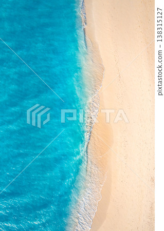 Relaxing aerial beach scene with turquoise ocean lagoon, waves and coastline, perfect summer vacation holiday banner, peaceful seaside drone view background Relaxing aerial beach scene with turquoise ocean lagoon, waves and coastline, perfect summer vacation holiday banner, peaceful seaside drone view background 138315127