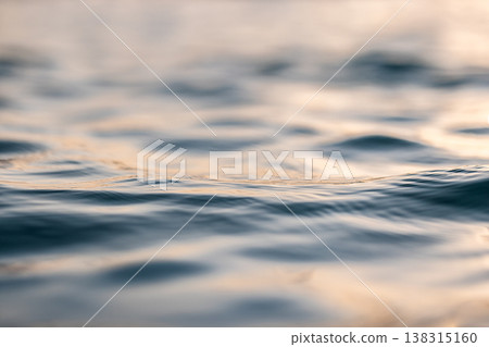 Ocean water sunset waves with vibrant colors, glowing reflections, serene tropical nature background Ocean water sunset waves with vibrant colors, glowing reflections, serene tropical nature background 138315160