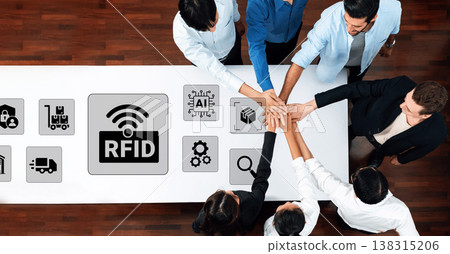Collaborative Teamwork Over Table Displaying RFID Technology Concepts and Icons Representing Innovation in Modern Business Practices Ledger 138315206