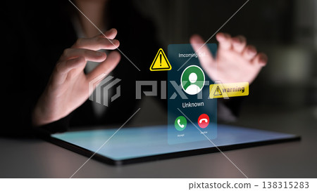 Hands Reaching Toward Floating Holographic Interface Displaying Incoming Call from Unknown Number with Warning Icons in Dark Setting Gantry Hands Reaching Toward Floating Holographic Interface Displaying Incoming Call from Unknown Number with Warning Icons in Dark Setting Gantry 138315283