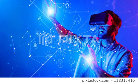 Young Man Engaging in Virtual Reality Experience with Futuristic Digital Interface and Data Visualization Effects in Blue Lighting. Raster Young Man Engaging in Virtual Reality Experience with Futuristic Digital Interface and Data Visualization Effects in Blue Lighting. Raster 138315410