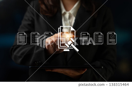 Business Professional Holding Tablet While Engaging with Digital Interface Representing Legal Documents and Compliance Processes in Modern Office Ledger Business Professional Holding Tablet While Engaging with Digital Interface Representing Legal Documents and Compliance Processes in Modern Office Ledger 138315464
