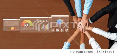 Collaborative Teamwork with Hands Together Over Data Metrics and Key Performance Indicators on a Wooden Table in an Office Setting Ledger Collaborative Teamwork with Hands Together Over Data Metrics and Key Performance Indicators on a Wooden Table in an Office Setting Ledger 138315591
