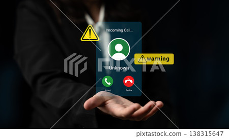 Virtual Phone Call Incoming Alert with Unknown Caller and Warning Sign Displayed on a Black Background to Represent Digital Communication Risks Gantry Virtual Phone Call Incoming Alert with Unknown Caller and Warning Sign Displayed on a Black Background to Represent Digital Communication Risks Gantry 138315647