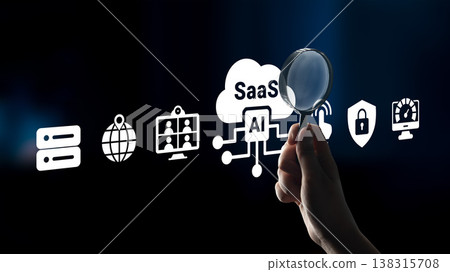 Hand Holding Magnifying Glass Over Various Icons Representing Technology, Cloud Computing, AI, Security, and Software as a Service in Modern Digital Environment Ledger 138315708