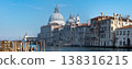 Morning light over historic domes and Venetian canal 138316215