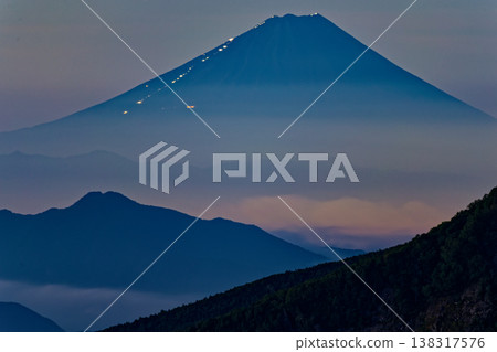 Mount Fuji and Mount Kayagatake at dawn, as seen from Mount Nyū in the northern Yatsugatake Mountains. Mount Fuji and Mount Kayagatake at dawn, as seen from Mount Nyū in the northern Yatsugatake Mountains. 138317576
