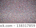 Colorful glitter texture background with sparkling particles in various shades and sizes 138317859