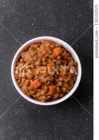 Lentil, carrot, and tomato stew with sausages, a European dish. Lentils with sausages Lentil, carrot, and tomato stew with sausages, a European dish. Lentils with sausages 138318525