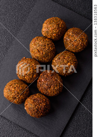 Falafel, a hearty Arabic dish made from boiled chickpeas for vegetarians. Chickpea falafel Falafel, a hearty Arabic dish made from boiled chickpeas for vegetarians. Chickpea falafel 138318563