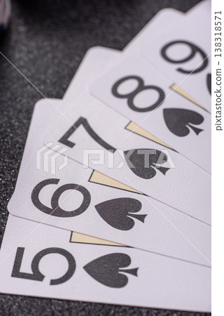 Playing cards and chips on a table, a gambling game of poker. Cards and chips Playing cards and chips on a table, a gambling game of poker. Cards and chips 138318571