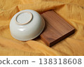 empty ceramic cup on the cutting board 138318608