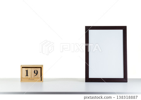 Wooden calendar 32 January with frame for photo on white table and background Wooden calendar 32 January with frame for photo on white table and background 138318887