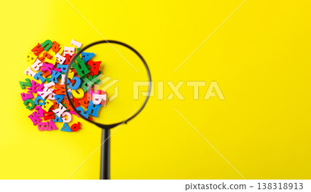 colored letters of the alphabet with a magnifying glass on a yellow background colored letters of the alphabet with a magnifying glass on a yellow background 138318913