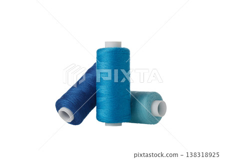 blue spool of sewing thread isolated on white background blue spool of sewing thread isolated on white background 138318925