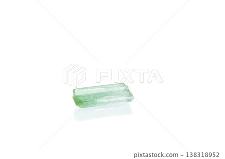 green tourmaline mineral stone macro on white background green tourmaline mineral stone macro on white background 138318952