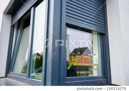 Modern house window with external roller shutter 138319279