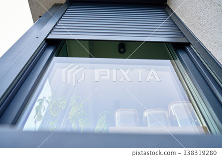 Modern window with roller shutter on residential facade Modern window with roller shutter on residential facade 138319280
