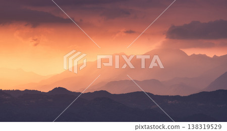 Amazing silhouettes of a mountains at colorful sunset in summer Amazing silhouettes of a mountains at colorful sunset in summer 138319529