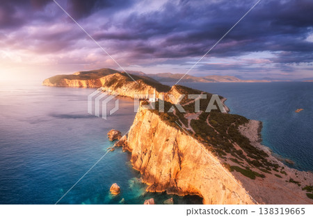 Lighthouse on the mountain peak at colorful sunset in summer Lighthouse on the mountain peak at colorful sunset in summer 138319665