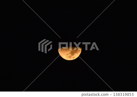 yellow half moon shining floating and covering by cloud on sky in night 138319853