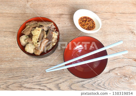 dry boiled braised beef meat and meatball couple organ on bowl dipping spicy chili sauce 138319854