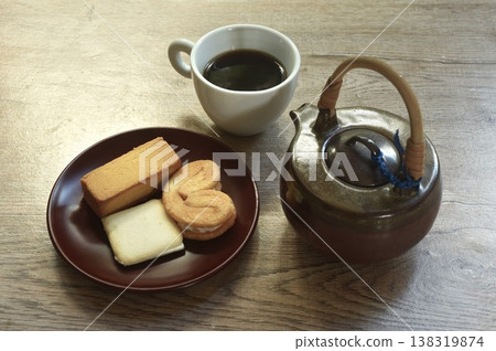 assorted sweet dessert pineapple pie and butterfly pie with black coffee cup on table assorted sweet dessert pineapple pie and butterfly pie with black coffee cup on table 138319874