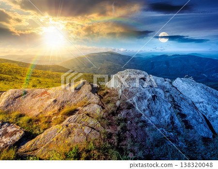 mountain landscape during solstice. day meet night. sun and moon over alpine meadow with huge boulders among the grass on top of the hillside near the peak of mountain ridge. remote outdoor adventure mountain landscape during solstice. day meet night. sun and moon over alpine meadow with huge boulders among the grass on top of the hillside near the peak of mountain ridge. remote outdoor adventure 138320048
