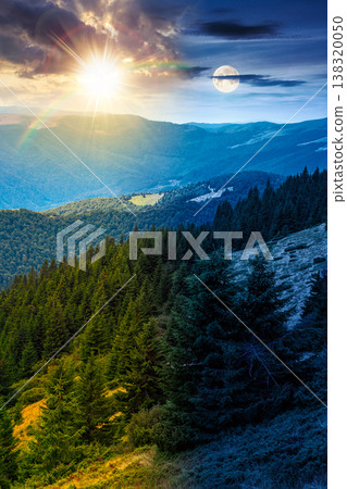 hillside of mountain range with coniferous forest and grassy meadow. day meet night. sun and moon over beautiful summer landscape with alp. wonderful nature background of highland for earth day 138320050