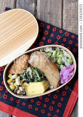 Japanese bento box with teriyaki yellowtail and edamame and salted kelp rice. Japanese bento box with teriyaki yellowtail and edamame and salted kelp rice. 138320072