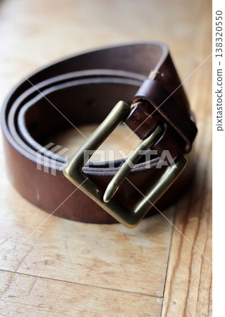 Worn brown leather belt 138320550