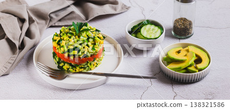 Diet salad with avocado, cucumber and red fish on a plate on the table web banner 138321586