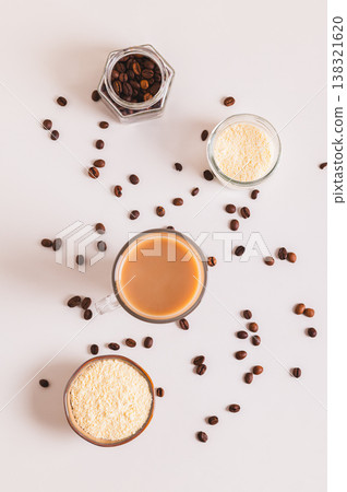 Protein coffee proffee for the morning ritual in a glass on the table top and vertical view 138321620