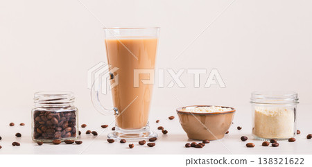 Protein coffee in a glass and protein powder in a bowl on the table web banner Protein coffee in a glass and protein powder in a bowl on the table web banner 138321622