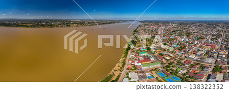 Twinkling City Lights of Nakhon Phanom Reflected on the Mekong River at Sunset Twinkling City Lights of Nakhon Phanom Reflected on the Mekong River at Sunset 138322352