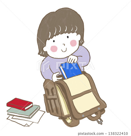 A child putting textbooks in their school bag. 138322410